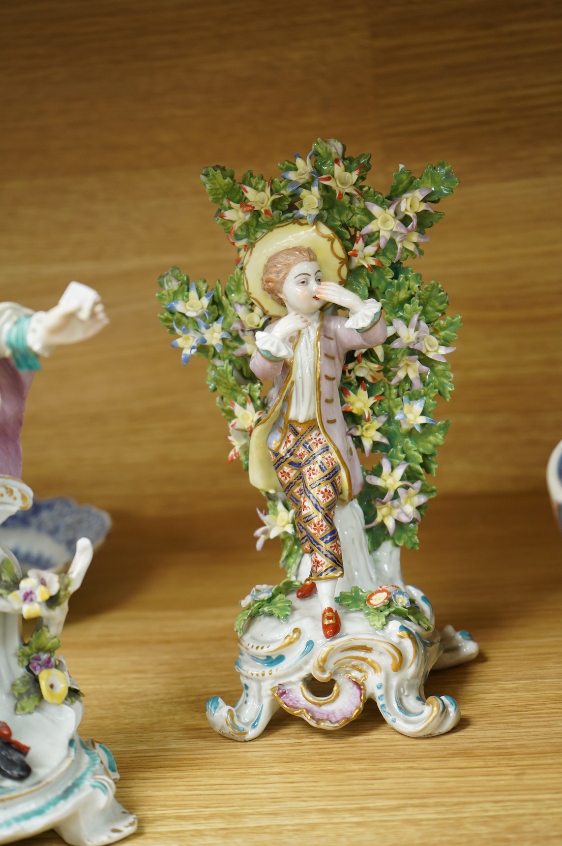 A Derby figure of a gentleman, c.1760, and a Continental porcelain figure, pseudo Bow mark, tallest 26cm high (2)
